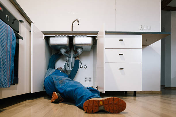 Professional Plumbing technician working in Adams, WI